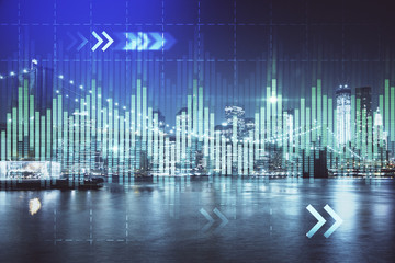 Financial graph on night city scape with tall buildings background multi exposure. Analysis concept.