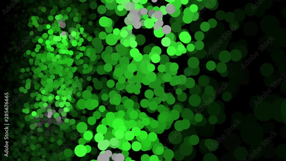 Poster lots of shimmering multicolored particles appearing, floating and fading on the black background. an