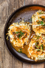 Potato cakes with gravy sauce and champignon