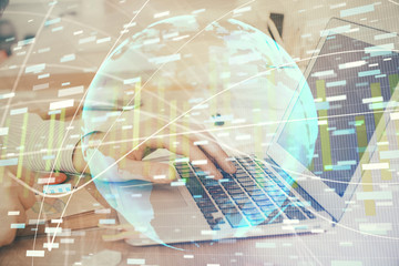 Multi exposure of businessman working on laptop on background. International business hologram in front. Concept of success.