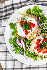 Potato cakes with sour cream and vegetables