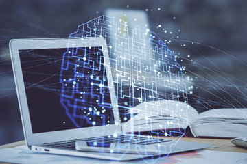 Double exposure of desktop with computer and brain drawing hologram. Artificial intelligence concept.