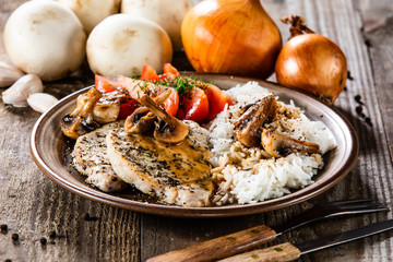 Grilled pork chop with white rice and mushroomson 