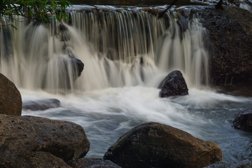 Obraz premium Beautiful rock waterfall in forest 
