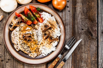 Grilled pork chop with white rice and mushroomson 