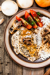 Grilled pork chop with white rice and mushroomson 