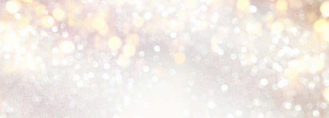 background of abstract glitter lights. silver and gold. de-focused. banner
