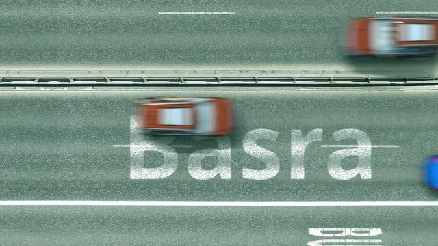 Overhead view of the busy car road with Basra text. Travel to Iraq intro clip