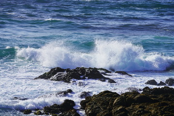 Beautiful coastline scenery with ocean waves and rocks cliff on Pacific Coast, California, US