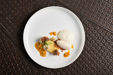 Fine dining dessert, Carrot cake,caramel ice cream, white chocolate mousse and spices