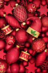 Fototapeta na wymiar Christmas background of red and gold decorative bauble tree decorations. Traditional symbols of the holiday season.