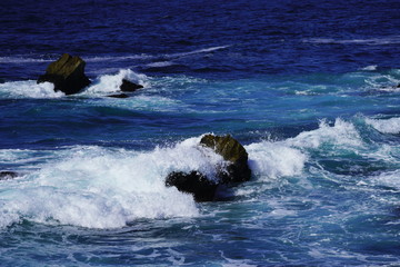 Beautiful coastline scenery with ocean waves and rocks on Pacific Coast, California, US