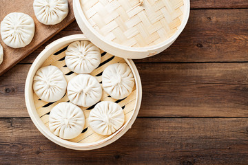 Fototapeta na wymiar Raw dumplings Dim Sum in bamboo steamer. 