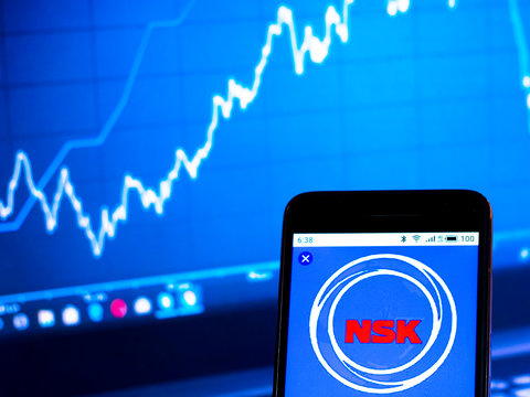 Kiev, Ukraine, July 18, 2019, illustrative editorial. In this photo illustration the NSK Ltd. logo is seen displayed on a smartphone