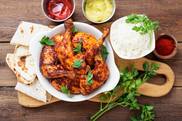 Tandoori chicken with jasmine rice and pita bread, indian cuisine.