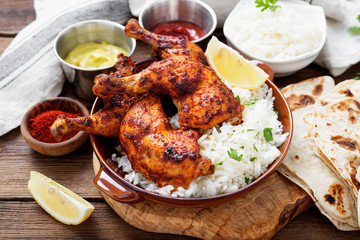 Tandoori chicken with jasmine rice and pita bread, indian cuisine. © Nelea Reazanteva