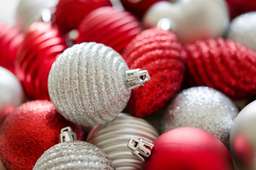 Red, silver Christmas balls. Festive background and wallpaper.