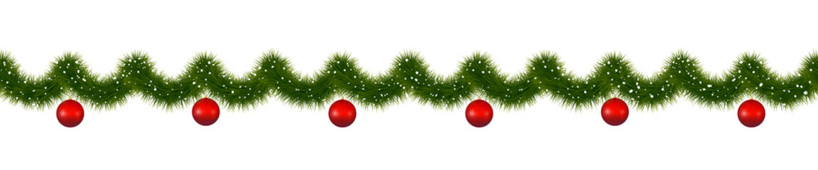 Christmas garland with red balls. New year decorations covered with snow.