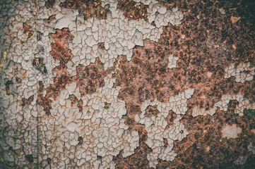 Cracked old brown wall background. Grungy and vignette texture