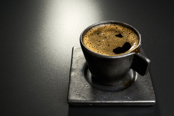 black coffee on black table