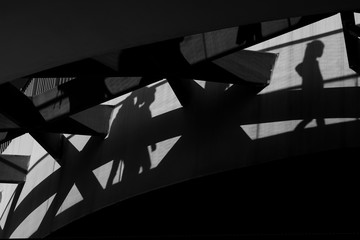 Fototapeta premium Shadows on the wall from walking people. Abstraction