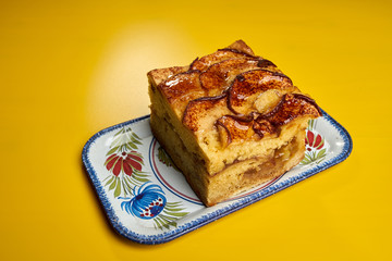 apple cake on yellow table