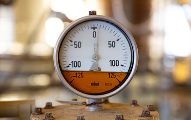 Industrial high pressure gas meters, pipelines and valves on blur background