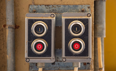 Push buttons, old retro industrial control panel. Start, stop concept