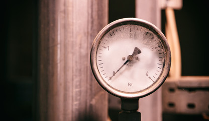Industrial high pressure gas meters, pipelines and valves on blur background