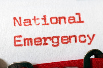 National Emergency typed on typewriter on red