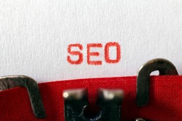 SEO typed on typewriter on red