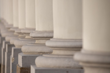 Architectural details of the building. Row of white columns.