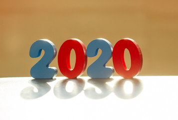 Happy New Year 2020. The number 2020 is written in wooden toy numbers. Beautiful card for the...