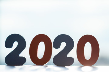 Happy New Year 2020. The number 2020 is written in wooden toy numbers. Beautiful card for the...