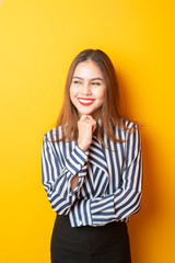 Naklejka premium Portrait of Beautiful woman on yellow background