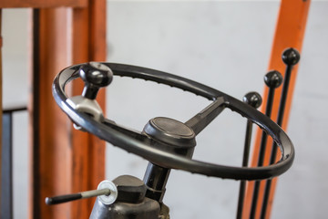Fototapeta na wymiar stacker steering wheel in a car workshop