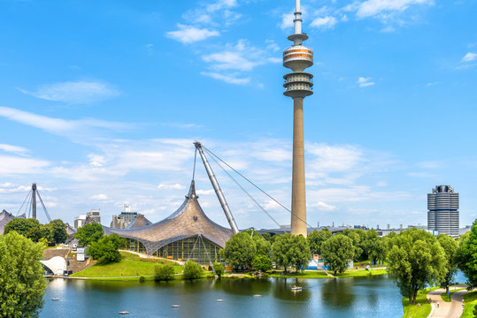 Olympic Park or Olympiapark in Munich. Landscape of former sport district. Scenery of Munich with tower and lake.