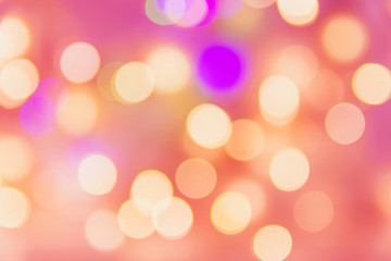 Christmas New year birthday holiday background with golden garland bokeh lights pastel pinkish backdrop. Template for poster card with copy space