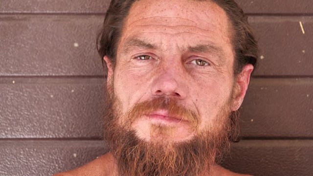 Real down-and-out person with no fixed abode, homeless man close-up