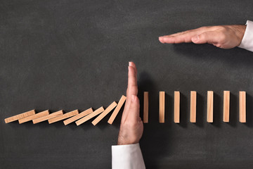 Domino Effect and Business Challenge Concept on Blackboard