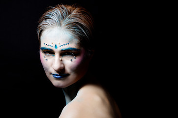 blue makeup for halloween, woman model in the studio