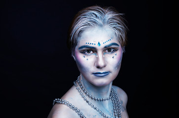 blue makeup for halloween, woman model in the studio