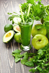  Glass of healthy celery smoothie with green apple, cucumber a healthy drink for detox