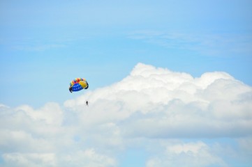 parasailing in the blue sky