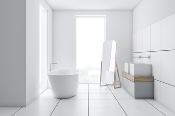 White tiled bathroom interior with mirror