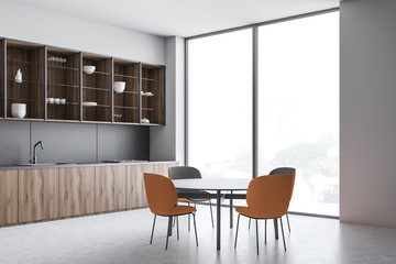 Fototapeta premium Loft kitchen corner with round dining table