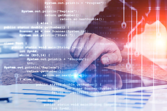 Man with tablet in office, code