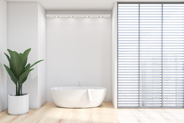 White bathroom with blinds and tub