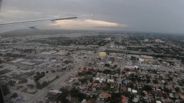 View from airplane window, landing in Miami on rainy day