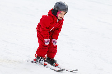 Little girl on ski